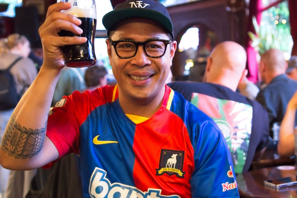 Crystal Palace fan with pint of Guinness